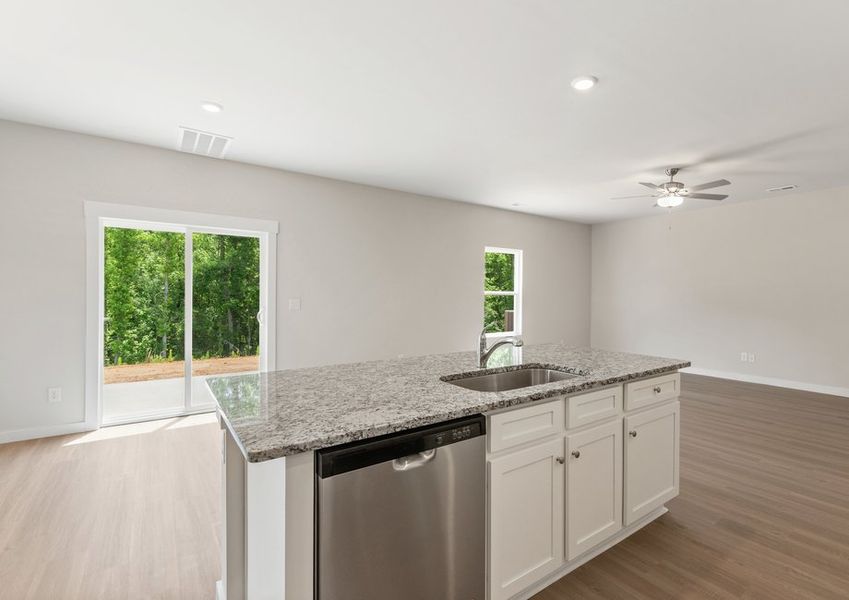 The kitchen overlooks the dining area The kitchen overlooks the dining area