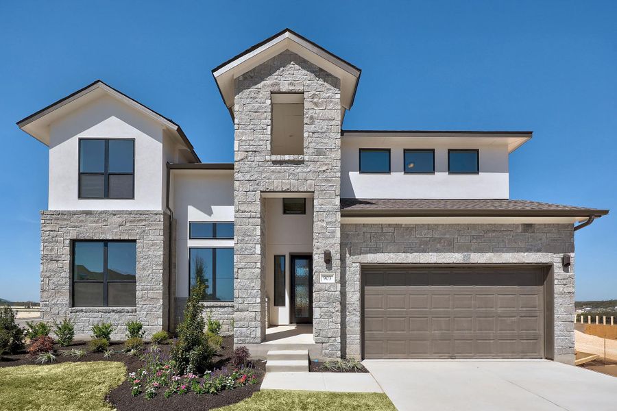 Front exterior of a new home in Lariat, Liberty Hill, TX, highlighting curb appeal (Image 2). Front exterior of a new home in Lariat, Liberty Hill, TX, highlighting curb appeal (Image 2).
