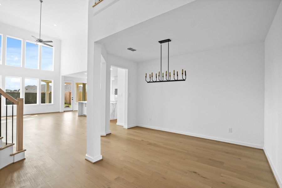 *REPRESENTATIONAL PHOTO* Formal Dining Overlooking the Wall of Windows