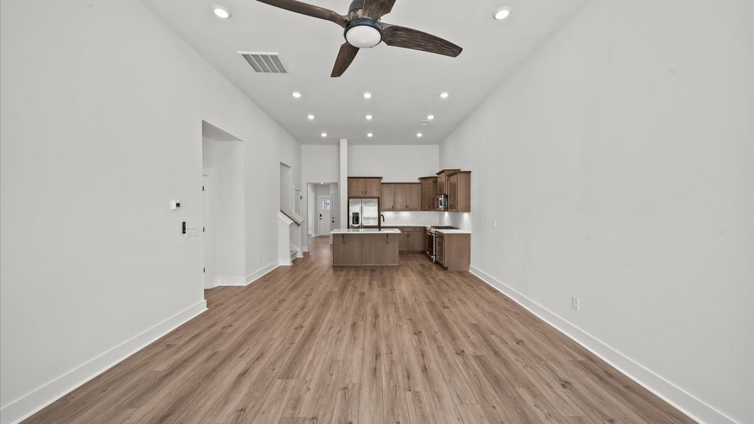 First-class living space featuring expansive ceilings, elegant design, and open sightlines to the kitchen