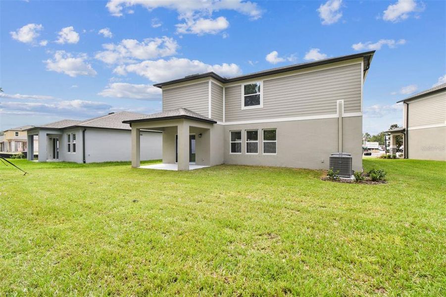 Exterior details and patio area of a home in Meadow Oaks, Hudson (Image 3).