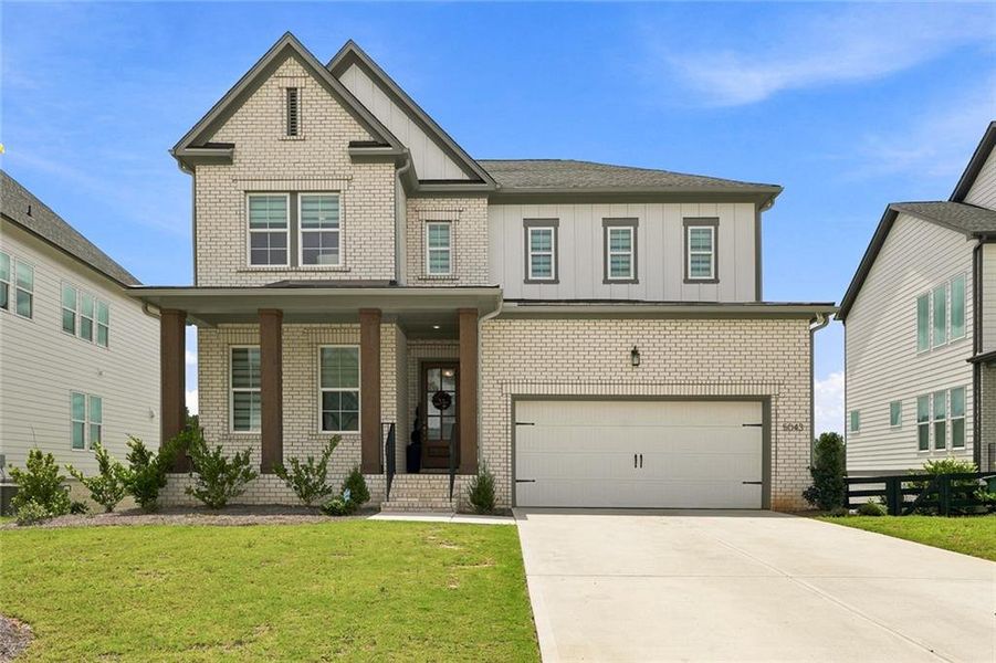 Front exterior of a new home in , Woodstock, GA, highlighting curb appeal (Image 2). Front exterior of a new home in , Woodstock, GA, highlighting curb appeal (Image 2).
