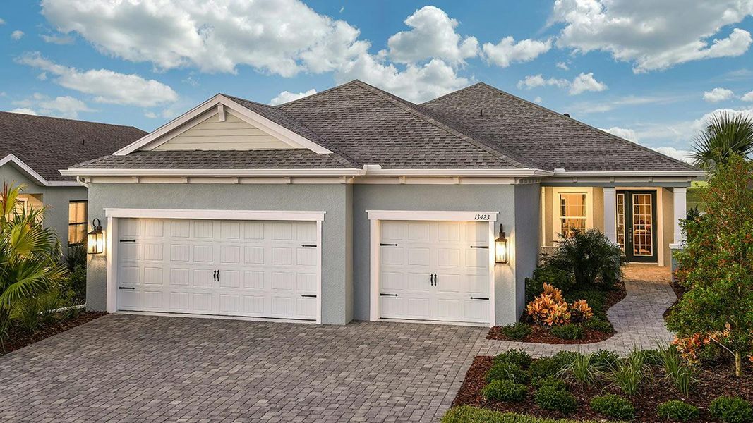Front exterior of a new home in Canoe Creek Real Estate and Homes for Sale in Parrish, FL - Neal Communities, Parrish, FL, highlighting curb appeal (Image 2).