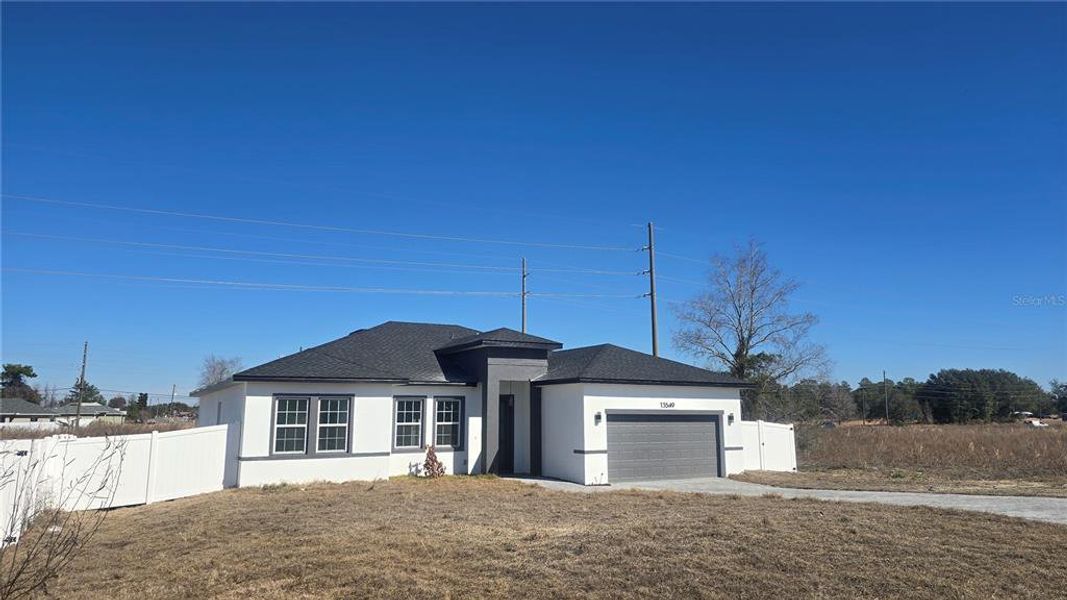 Front exterior of a new home in , Ocala, FL, highlighting curb appeal (Image 23). Front exterior of a new home in , Ocala, FL, highlighting curb appeal (Image 23).