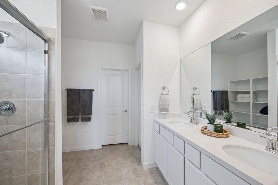 Primary Suite Bathroom designed with elegance and every day comfort.  Thoughtful finishes, abundant storage and spacious layout.
