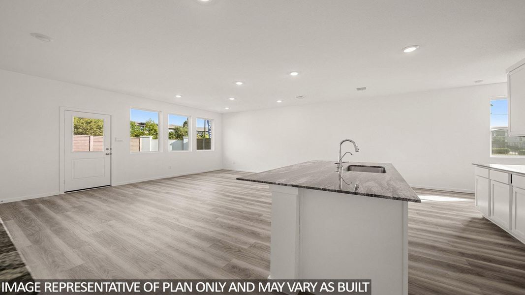 Kitchen island featuring a single-basin sink with a gooseneck faucet