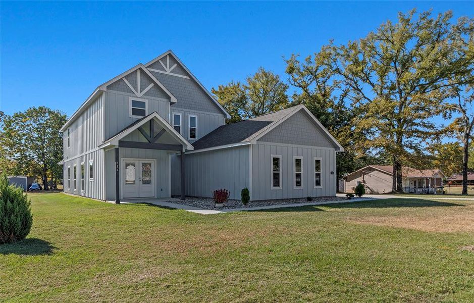 Front exterior of a new home in , Tool, TX, highlighting curb appeal (Image 17). Front exterior of a new home in , Tool, TX, highlighting curb appeal (Image 17).