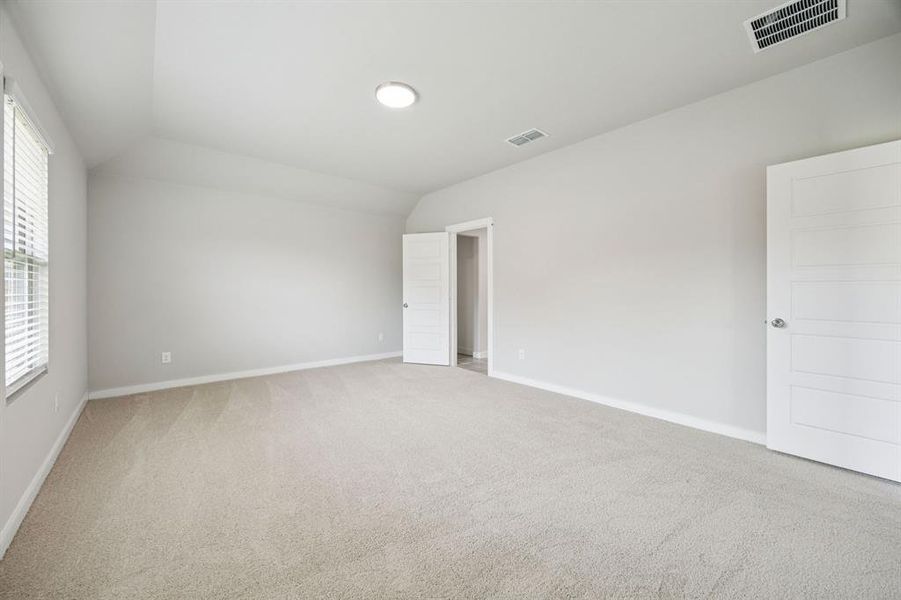 Primary Suite in the Hayden home plan by Trophy Signature Homes – REPRESENTATIVE PHOTO