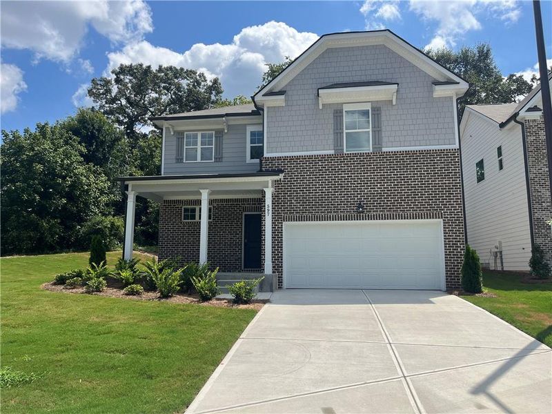 Front exterior of a new home in Reserve at South River Gardens, Atlanta, GA, highlighting curb appeal (Image 1). Front exterior of a new home in Reserve at South River Gardens, Atlanta, GA, highlighting curb appeal (Image 1).
