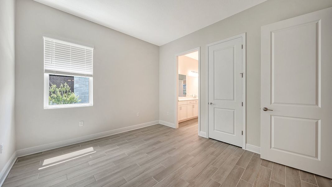 Spacious, unfurnished interior of a new home in Canoe Creek Real Estate and Homes for Sale in Parrish, FL - Neal Communities, Parrish (Image 60).