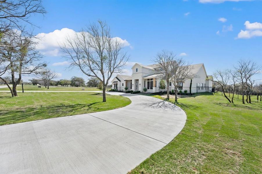 Modern farmhouse with curved driveway