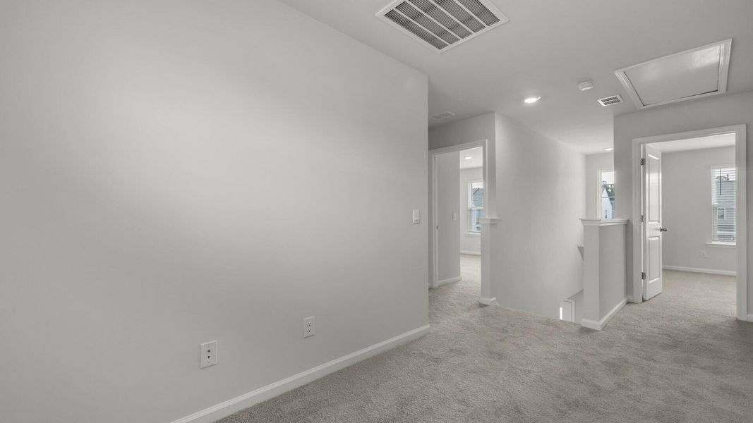 Spacious, unfurnished interior of a new home in Pine Hills Townhomes at Cane Bay, Summerville (Image 17).