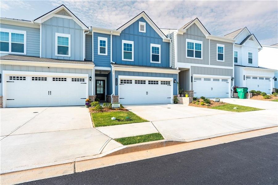 Front exterior of a new home in Ellison Square, Sugar Hill, GA, highlighting curb appeal (Image 21).