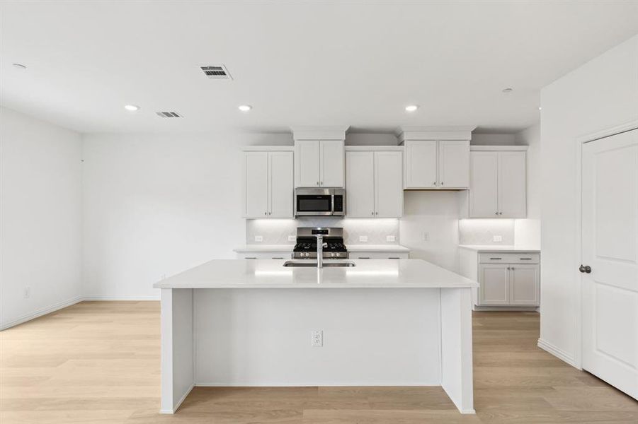 The spacious island is the hub of your new kitchen and the perfect place for friends and family to gather round! The spacious island is the hub of your new kitchen and the perfect place for friends and family to gather round!