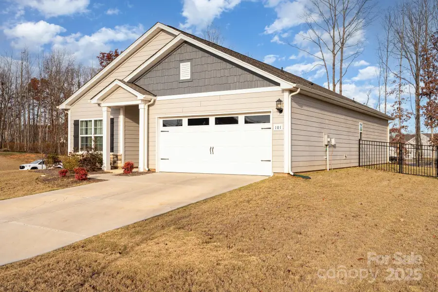 Front exterior of a new home in , Troutman, NC, highlighting curb appeal (Image 1).