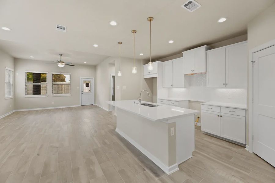 Representative furnished interior of a home built from the Sedona by Chesmar Homes in Sunterra, Katy (Image 4).