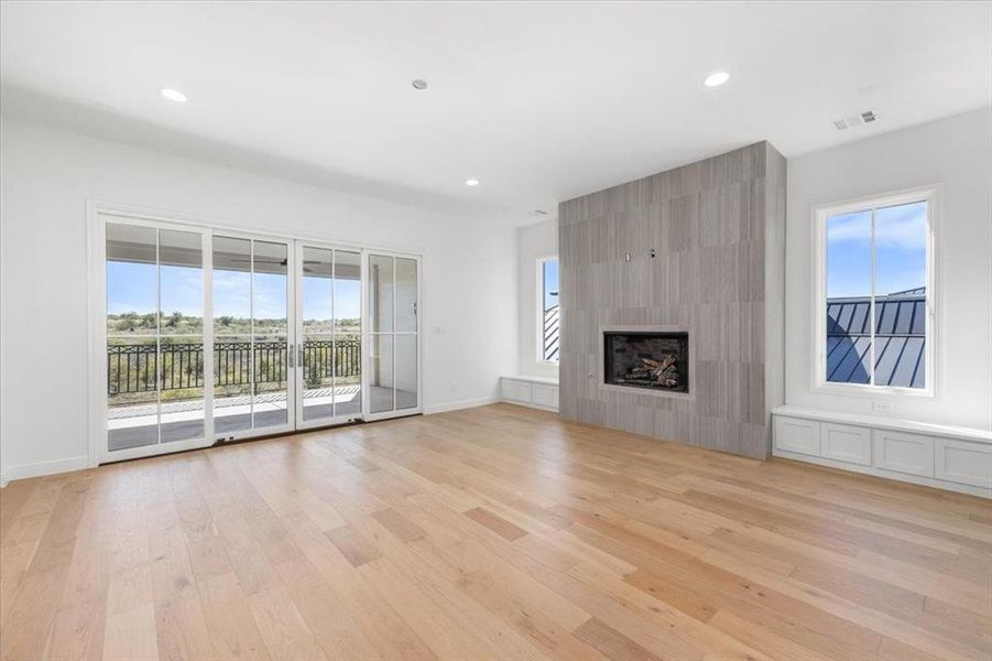 2nd floor with fireplace and access to outdoor living on balcony