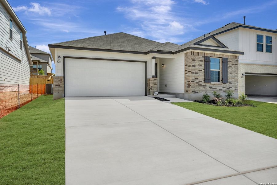 Front exterior of a new home in Mesquite Ridge, San Antonio, TX, highlighting curb appeal (Image 26).