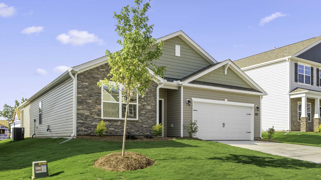 Front exterior of a new home in Colly Farm, Stokesdale, NC, highlighting curb appeal (Image 14). Front exterior of a new home in Colly Farm, Stokesdale, NC, highlighting curb appeal (Image 14).