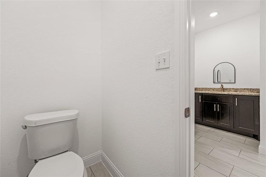 Bathroom featuring vanity and toilet