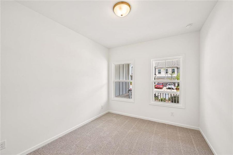 Spacious, unfurnished interior of a new home in Eastlyn Crossing, Flowery Branch (Image 15).