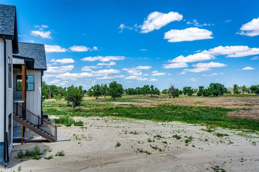 Front exterior of a new home in , Byers, CO, highlighting curb appeal (Image 28).