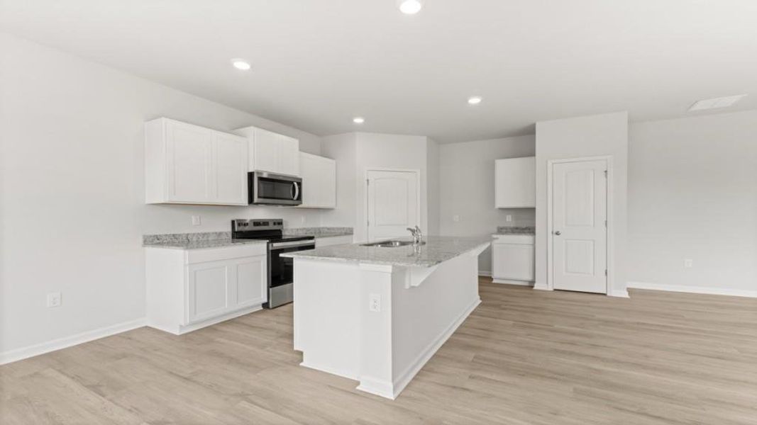 Furnished interior view inside a new home in Oaks at Cedar Grove, Fairburn (Image 3).
