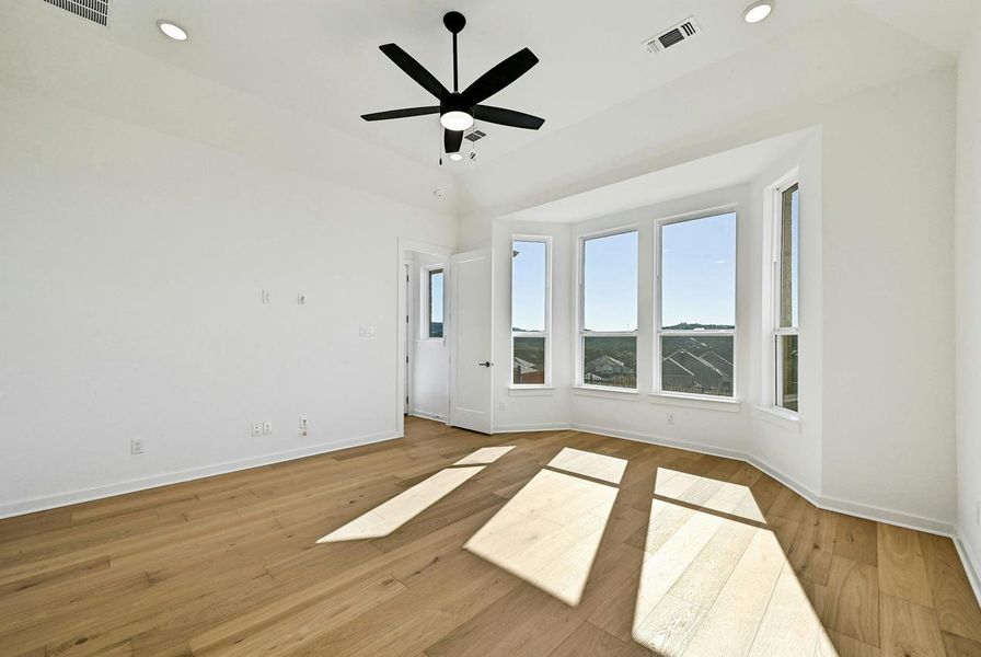 Unfurnished room with ceiling fan, wood finished floors, and recessed lighting