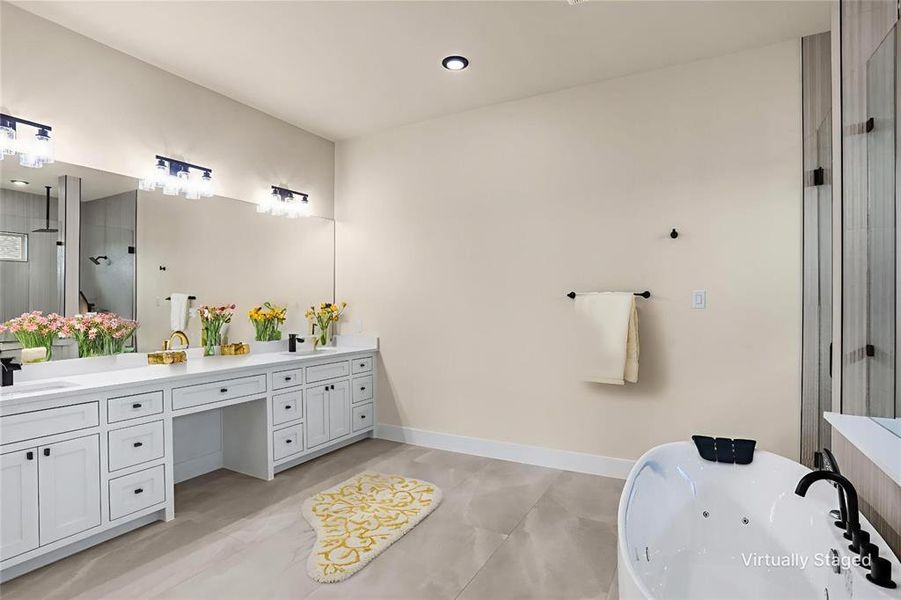 Full bathroom with double vanity, a freestanding tub, and a stall shower Full bathroom with double vanity, a freestanding tub, and a stall shower