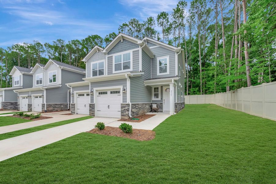 Front exterior of a new home in Ashmore Townes, Garner, NC, highlighting curb appeal (Image 2). Front exterior of a new home in Ashmore Townes, Garner, NC, highlighting curb appeal (Image 2).
