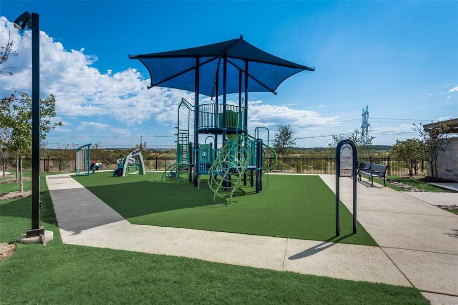 View of playground with a yard