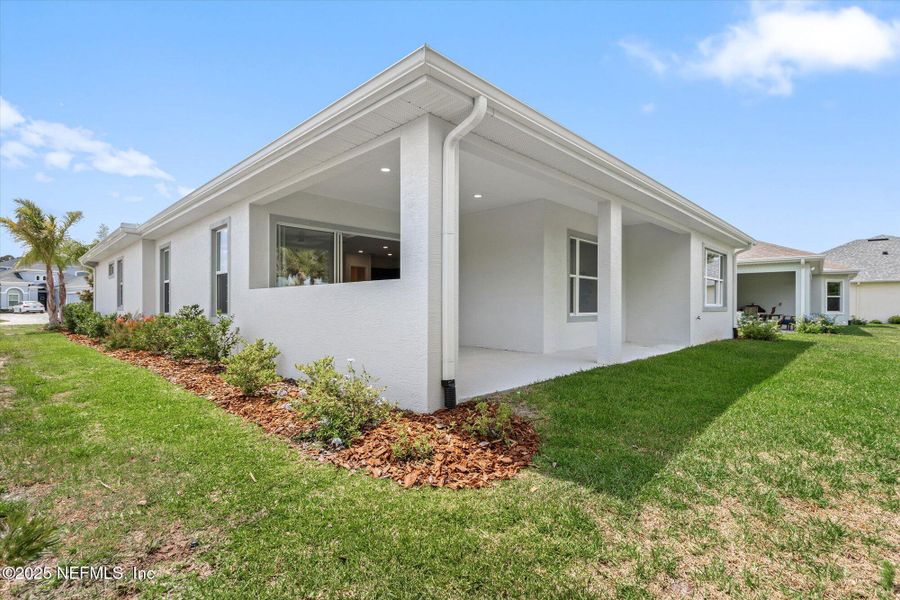 Front exterior of a new home in , Palm Coast, FL, highlighting curb appeal (Image 1). Front exterior of a new home in , Palm Coast, FL, highlighting curb appeal (Image 1).