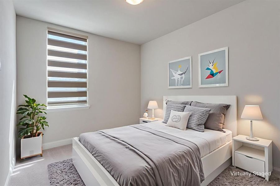 Carpeted bedroom featuring baseboards Carpeted bedroom featuring baseboards