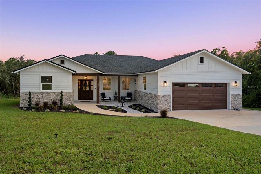Front exterior of a new home in , Webster, FL, highlighting curb appeal (Image 27).
