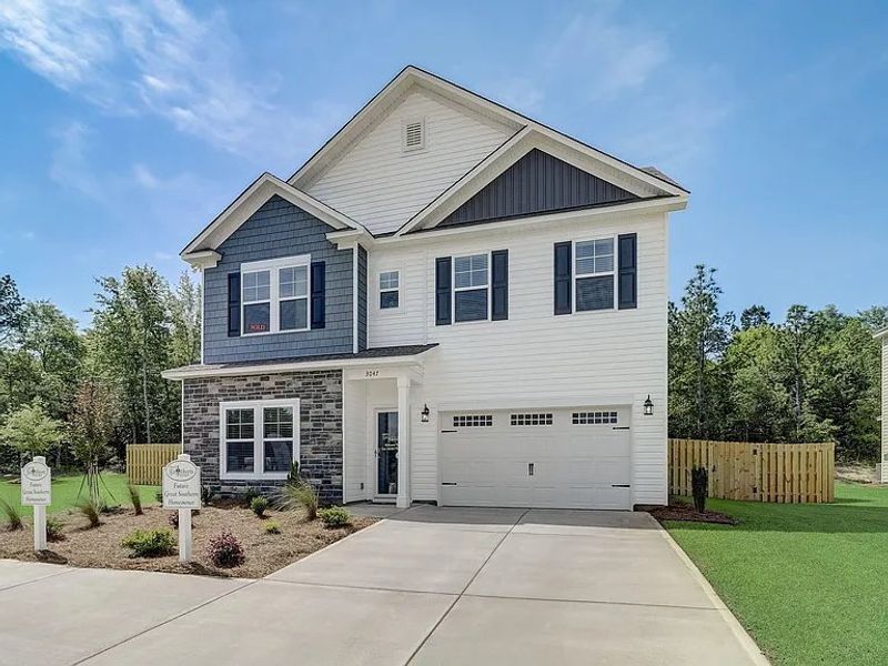 Front exterior of a new home in Providence Station at Trolley Run, Aiken, SC, highlighting curb appeal (Image 2). Front exterior of a new home in Providence Station at Trolley Run, Aiken, SC, highlighting curb appeal (Image 2).