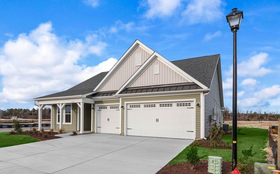 Front exterior of a new home in Traditions at Carolina Forest, Myrtle Beach, SC, highlighting curb appeal (Image 1). Front exterior of a new home in Traditions at Carolina Forest, Myrtle Beach, SC, highlighting curb appeal (Image 1).