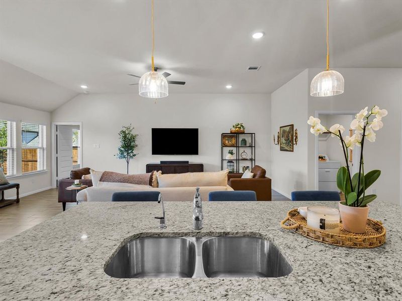 Beautiful pendant light illuminate the kitchen island.