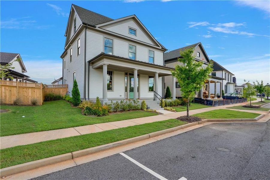 Front exterior of a new home in Eastmore, Conyers, GA, highlighting curb appeal (Image 26).