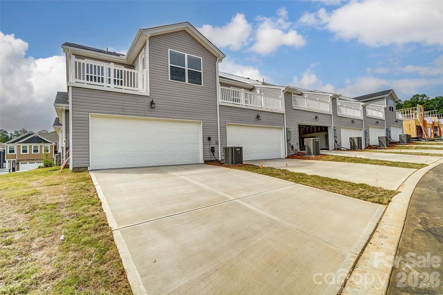 Front exterior of a new home in Cheyney, Charlotte, NC, highlighting curb appeal (Image 25).