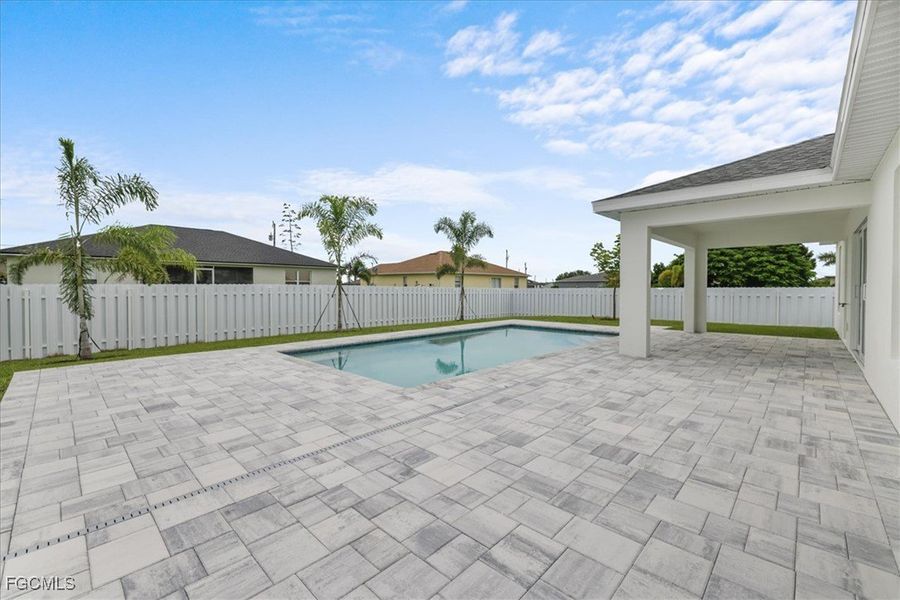 Front exterior of a new home in Cape Coral, Cape Coral, FL, highlighting curb appeal (Image 25). Front exterior of a new home in Cape Coral, Cape Coral, FL, highlighting curb appeal (Image 25).
