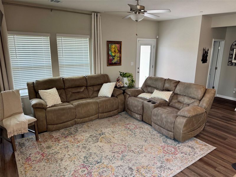 Living area featuring wood-finish flooring and neutral wall tones