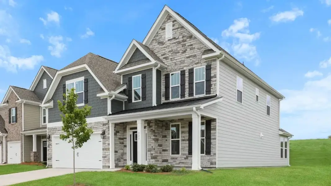 Front exterior of a new home in Spring Ridge Reserve, Anderson, SC, highlighting curb appeal (Image 2). Front exterior of a new home in Spring Ridge Reserve, Anderson, SC, highlighting curb appeal (Image 2).