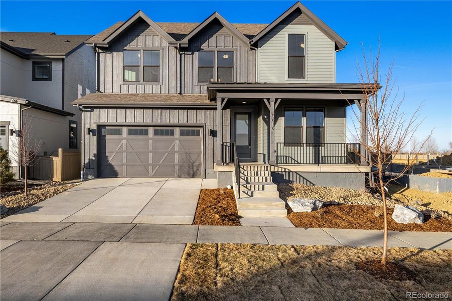 Front exterior of a new home in West Grange, Longmont, CO, highlighting curb appeal (Image 26).