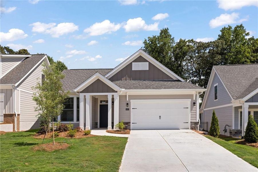 Front exterior of a new home in The Courtyards at Bailey Farm, Dacula, GA, highlighting curb appeal (Image 4).