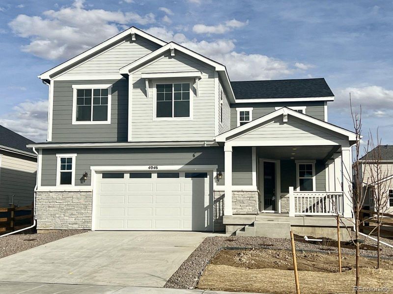 Front exterior of a new home in The Aurora Highlands, Aurora, CO, highlighting curb appeal (Image 1). Front exterior of a new home in The Aurora Highlands, Aurora, CO, highlighting curb appeal (Image 1).