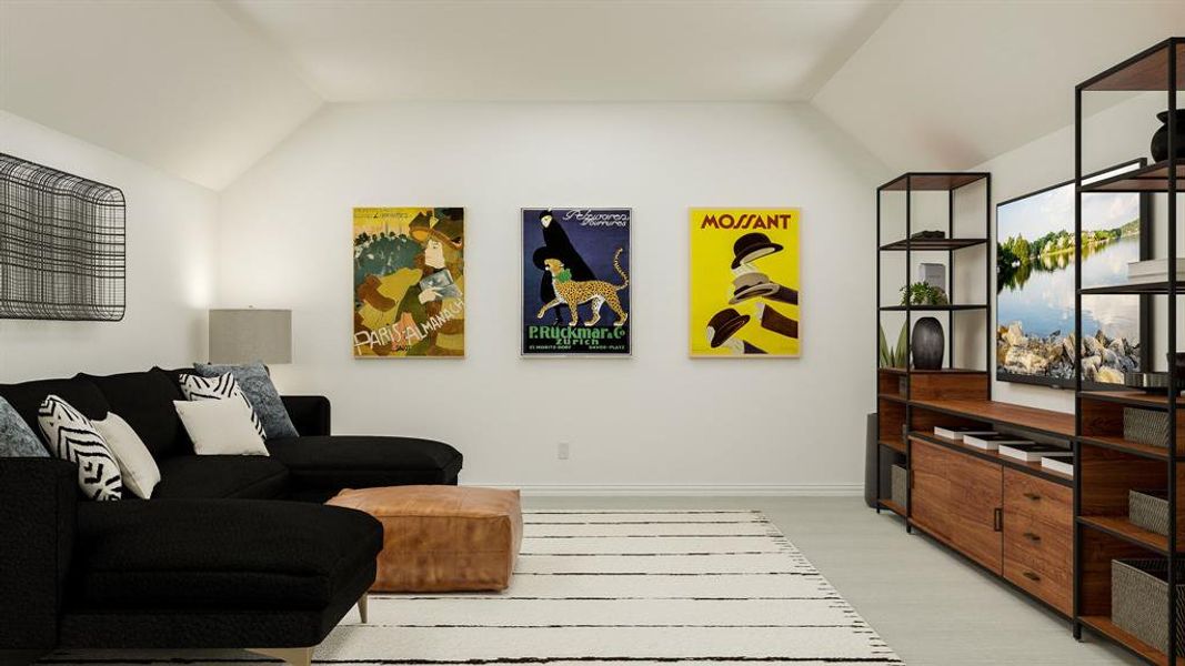 Sitting room with light wood-type flooring and vaulted ceiling