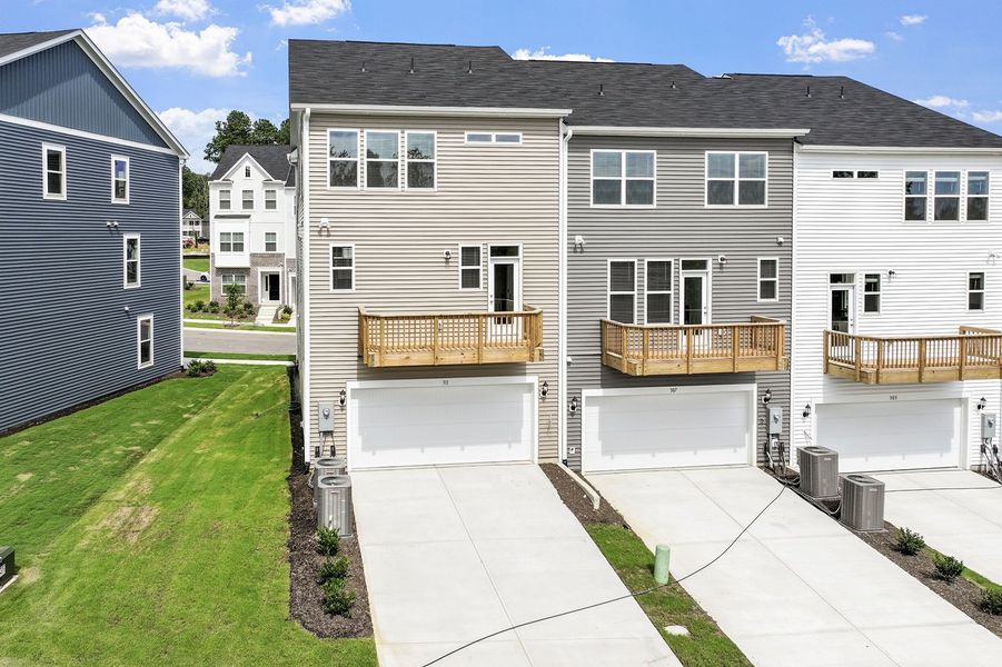 Front exterior of a new home in Renaissance at White Oak, Garner, NC, highlighting curb appeal (Image 25). Front exterior of a new home in Renaissance at White Oak, Garner, NC, highlighting curb appeal (Image 25).