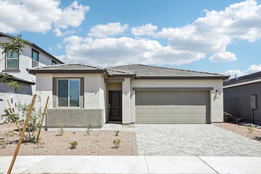 Front exterior of a new home in North Copper Canyon, Surprise, AZ, highlighting curb appeal (Image 1). Front exterior of a new home in North Copper Canyon, Surprise, AZ, highlighting curb appeal (Image 1).