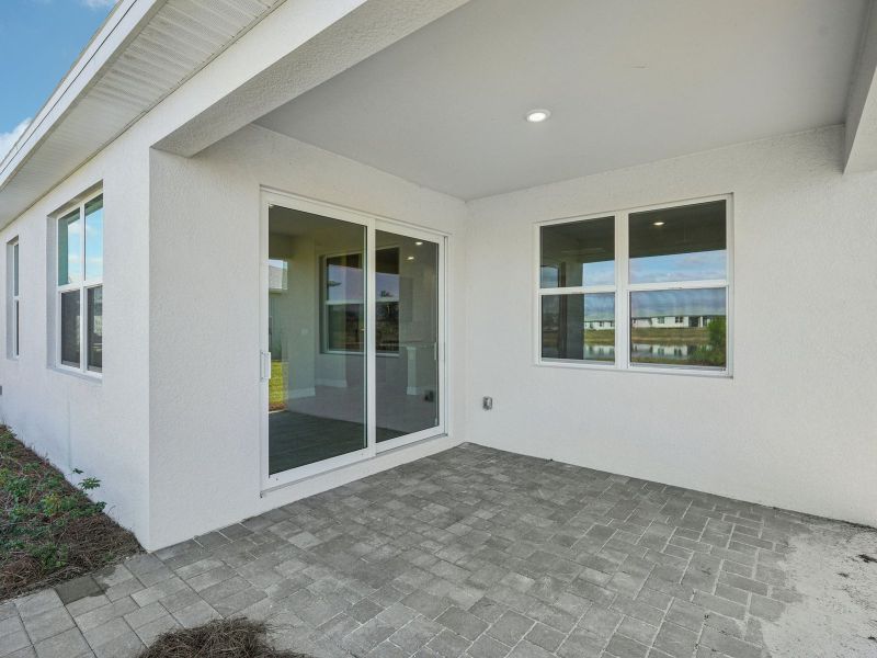 Exterior details and patio area of a home in Crescent Lakes - Reserve Series, Punta Gorda (Image 4).