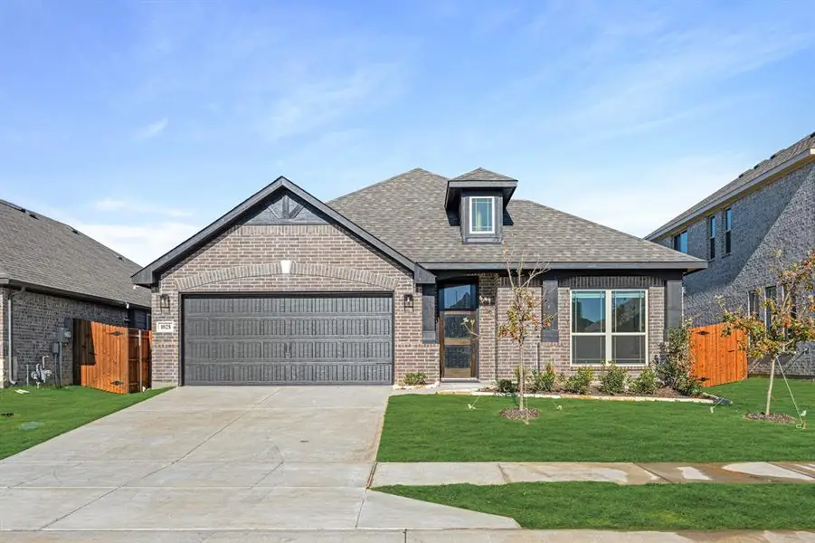Front exterior of a new home in Star Ranch Classic 50, Godley, TX, highlighting curb appeal (Image 1).